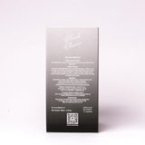 Back of Black Elixir Eau De Parfum packaging showing ingredients and product details.