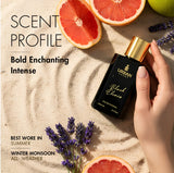 Black Elixir Eau De Parfum bottle on sandy surface with citrus fruits and lavender accents.