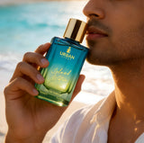 Urban Scent Island Water unisex Eau de Parfum bottle held by model in sunlight, 100ml.