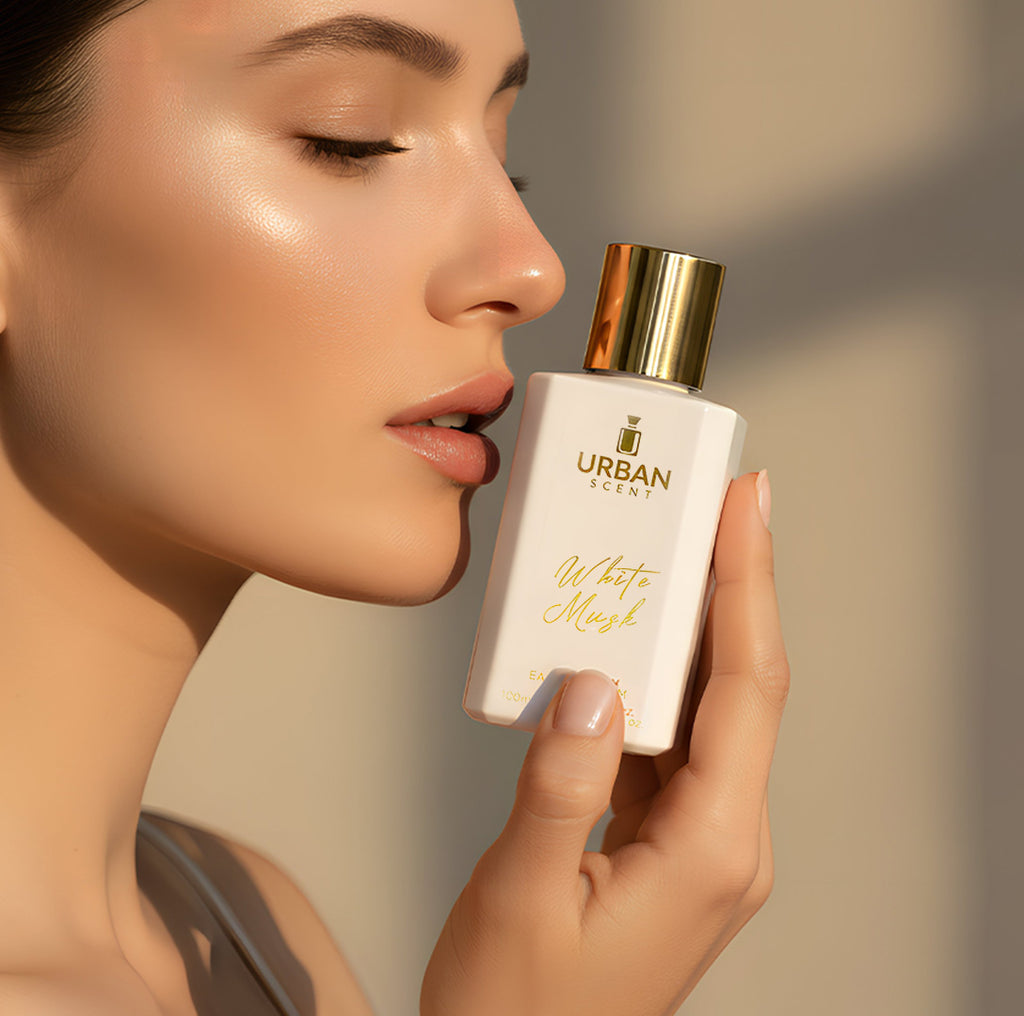 Urban Scent White Musk Eau De Parfum for unisex displayed by a model, showcasing the elegant fragrance bottle.