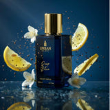 Urban Scent Deep Blue Eau de Parfum in a bottle with lemon and flowers, showcasing freshness and sophistication.